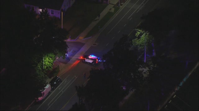 Generic police lights and yellow police tape at crime scene 