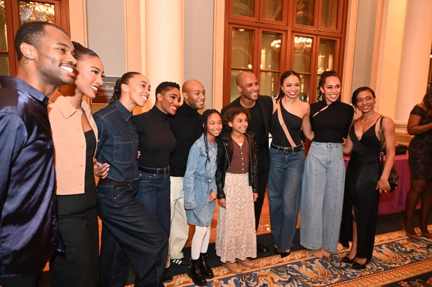 People post for photos at Alvin Ailey American Dance Theater Party at Ensemble Arts 