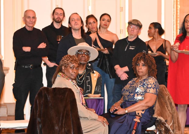 People post for photos at Alvin Ailey American Dance Theater Party at Ensemble Arts 