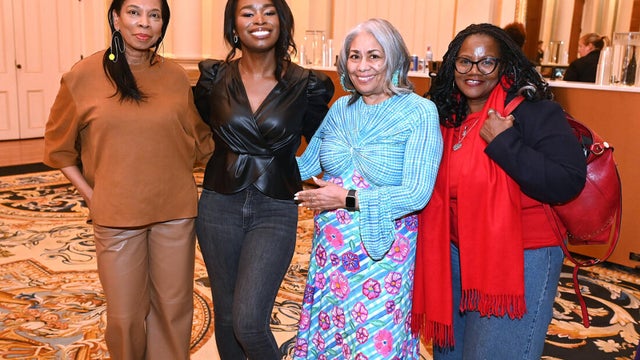 People post for photos at Alvin Ailey American Dance Theater Party at Ensemble Arts 