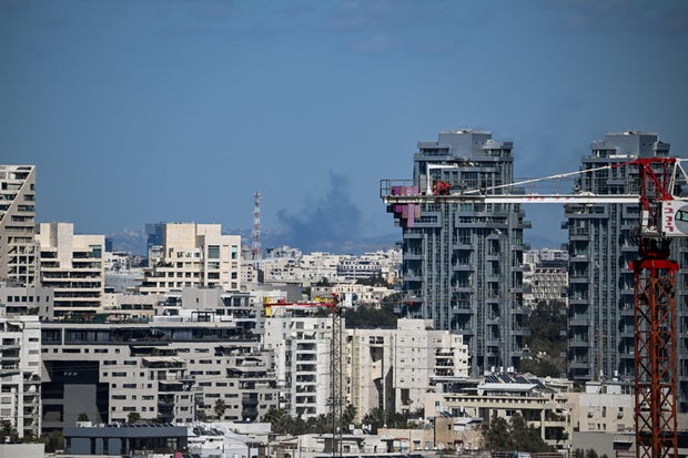 Smoke rises following an Iranian projectile strike, in Tel Aviv 