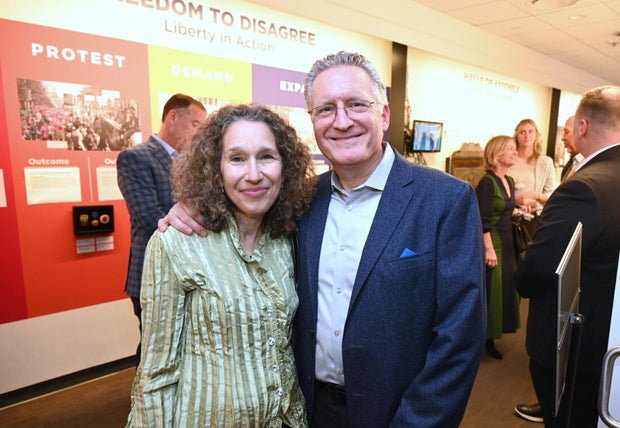 People pose for photos during an event at the National Liberty Museum 