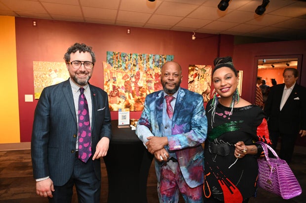 People pose for photos during an event at the National Liberty Museum 