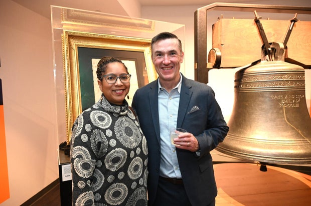 People pose for photos during an event at the National Liberty Museum 