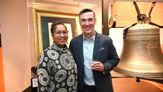 People pose for photos during an event at the National Liberty Museum 