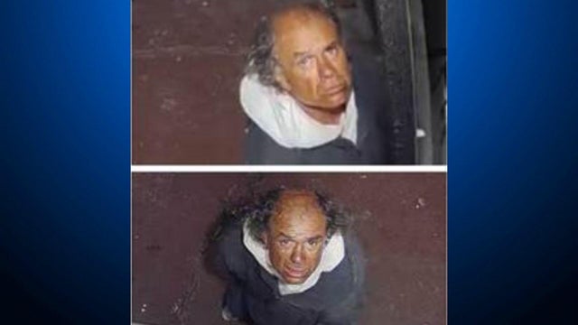 a balding man in his 40s or 50s stares up at a camera 