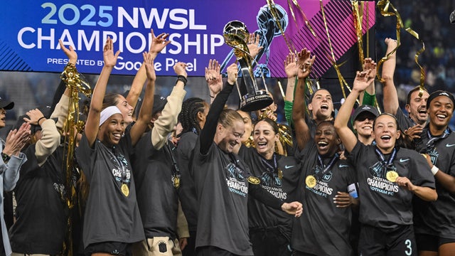 NJ/NY Gotham FC defender Emily Sonnett, center, lifts the NWSL championship trophy after defeating the Washington Spirit in an NWSL women's championship soccer match Nov. 22, 2025, in San Jose, Calif. 