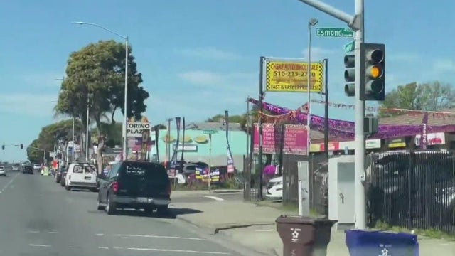 A row of storefronts on a city street 
