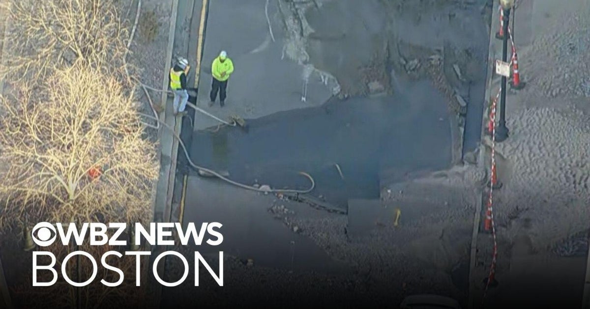 Boston street buried in dirt and rocks after huge water main break ...