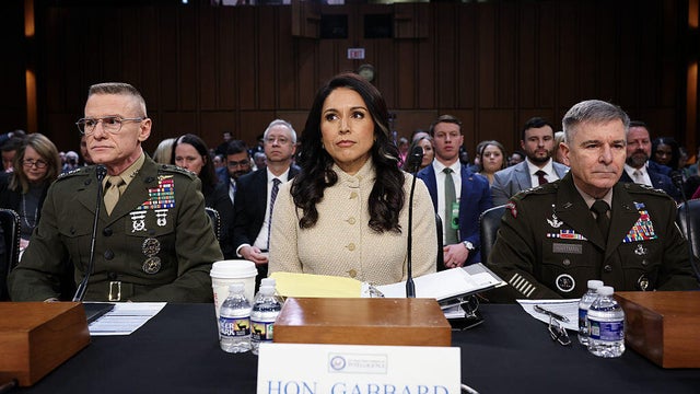 DIA Director Lt. Gen. James Adams III, Director of National Intelligence Tulsi Gabbard and Army Lt. Gen. William Hartman prepare to testify at a Senate Intelligence Committee hearing at the Hart Senate Office Building in Washington, D.C., on March 18, 202 