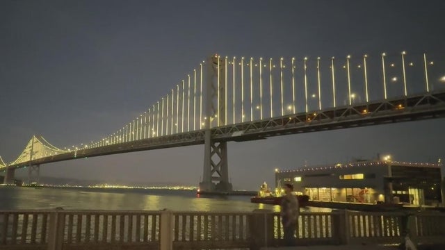 a bridge with tens of thousands of LED lights on it 