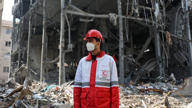 Red Crescent rescue team at the site of a building that was damaged by a strike, in Tehran 