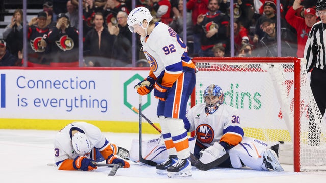 Simon Holmstrom #92, Adam Pelech #3 and Ilya Sorokin #30 of the New York Islanders after Brady Tkachuk #7 of the Ottawa Senators [NOT PICTURED] scores a go ahead goal in the third period on March 19, 2026, at Canadian Tire Centre in Ottawa, ON, Canada. 