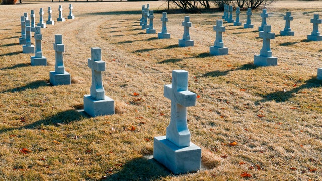 Cemetery With all Identical Christian Cross Grave Stones 