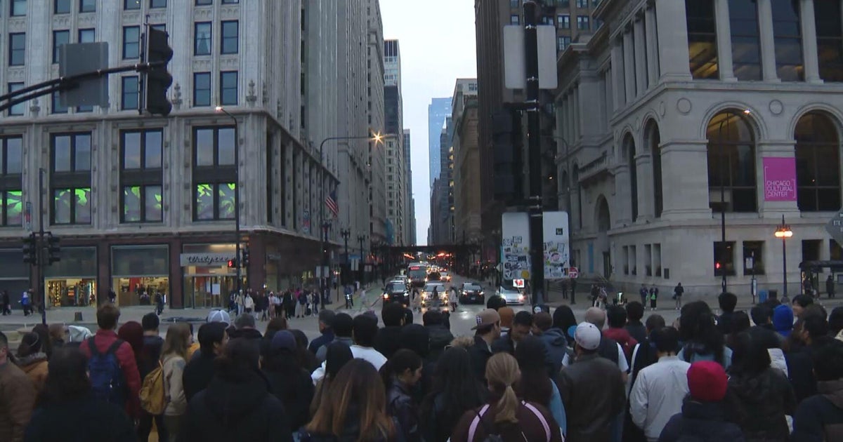 Cloudy skies don't deter crowds from trying to catch glimpse of "Chicagohenge" on first day of spring