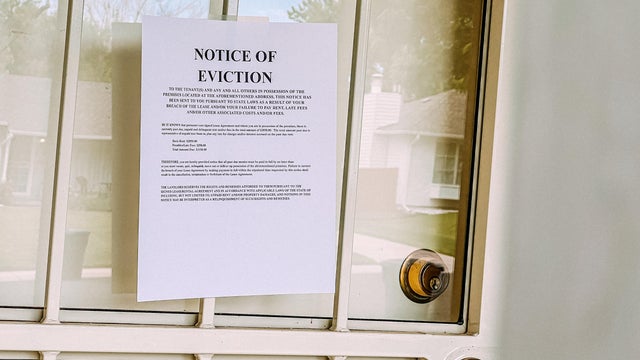 Paper Eviction Notice Flyer on the Front Door of a Home in the United States 