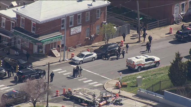 Police and police vehicles on the scene of a shooting in Wilmington, Delaware 