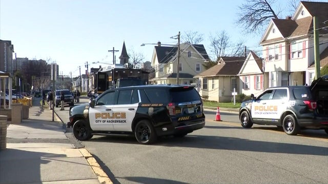 Hackensack Police vehicles on a residential street 