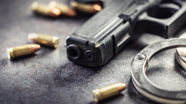 Police pistol, bullets, lantern and handcuffs. 