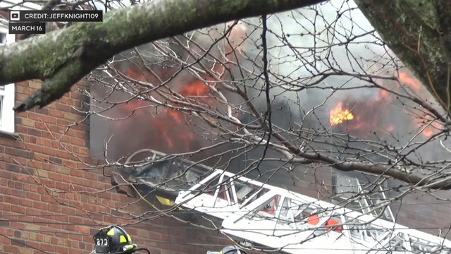 Flames shoot out windows 