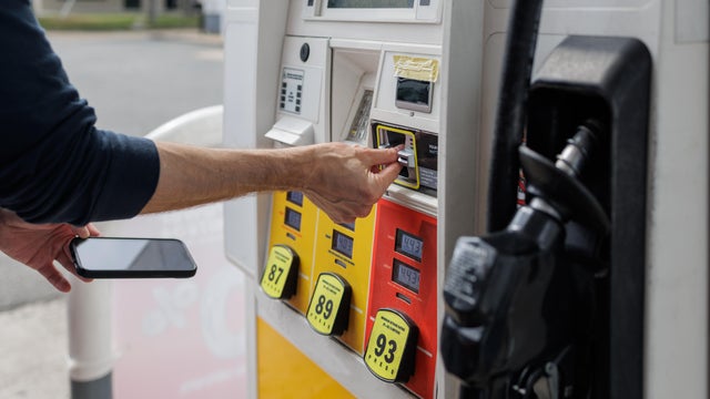 Man Pays for Gas at Pump 