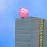 Savings concept - Piggy bank on cash 