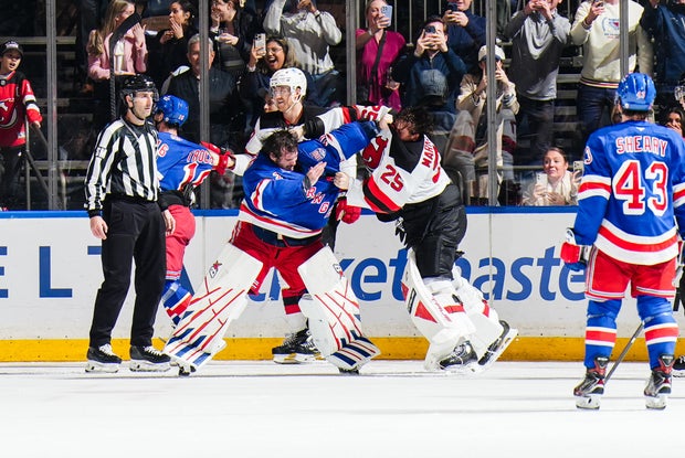 Igor Shesterkin #31 of the New York Rangers and Jacob Markstrom #25 of the New Jersey Devils fight at Madison Square Garden on March 31, 2026 in New York City. 