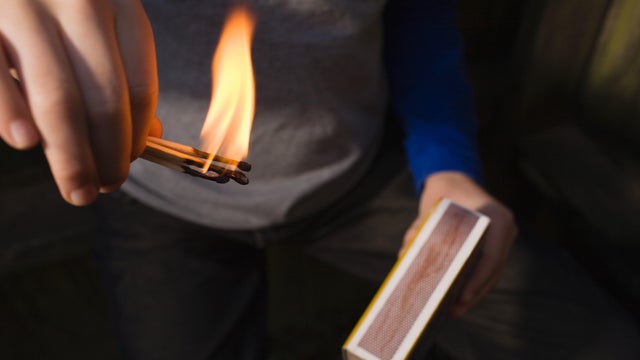 Boy playing with fire 