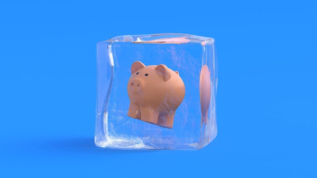 Piggy bank in ice cube. 3d illustration 