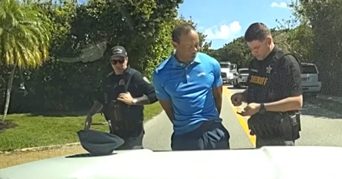 Body cam video shows Tiger Woods in handcuffs after car crash in Florida