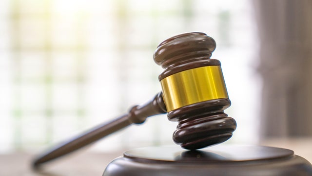 Judges gavel in courtroom legal trial and law background 