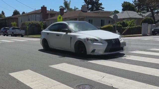 A vehicle passes through an intersection 