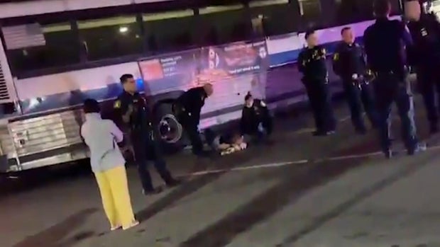 MTA bus driver laying on ground 