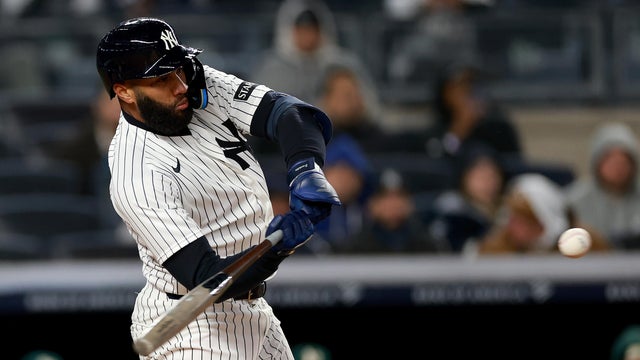 Amed Rosario #14 of the New York Yankees hits a two run home run in the eighth inning against the Athletics at Yankee Stadium on April 07, 2026 in the Bronx borough of New York City. 