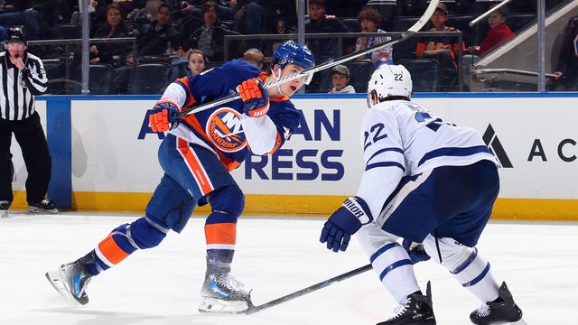 Matthew Schaefer #48 of the New York Islanders takes a first period shot against Jake McCabe #22 and the Toronto Maple Leafs at UBS Arena on April 09, 2026 in Elmont, New York. 