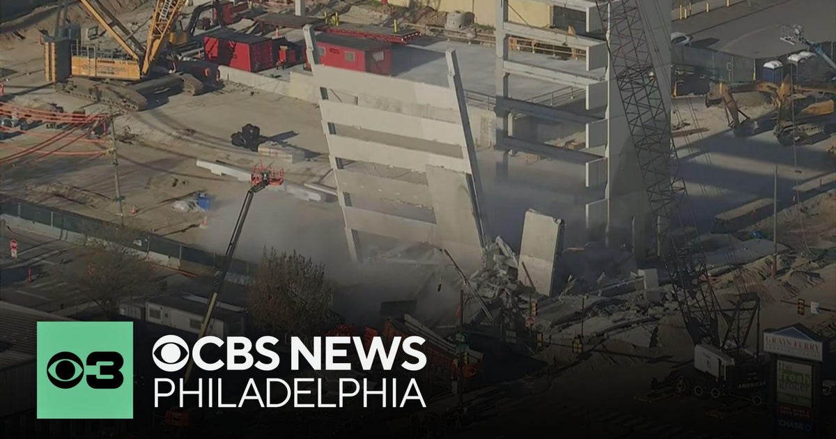 Wrecking ball demolishes part of parking garage in Grays Ferry, Philadelphia