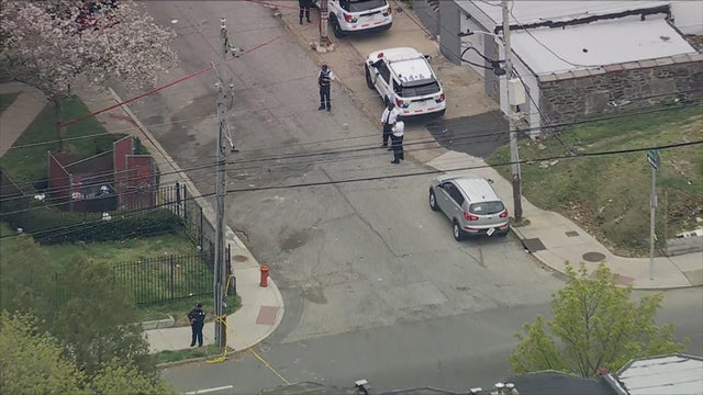 Police cars and officers on the scene of the shooting on Chew Avenue in Philadelphia 