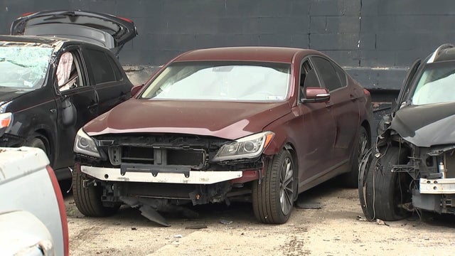 Damaged cars in the lot at Wheels Up Towing in Philadelphia 