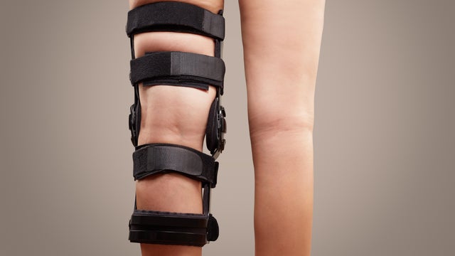Knee support brace on leg, knee fixation and prevent pain. Orthotic equipment, orthotics 