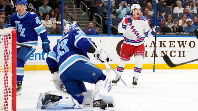 New York Rangers left wing Tye Kartye (24) celebrates after scoring past Tampa Bay Lightning goaltender Brandon Halverson (33) during the first period of an NHL hockey game Wednesday, April 15, 2026, in Tampa, Fla. 