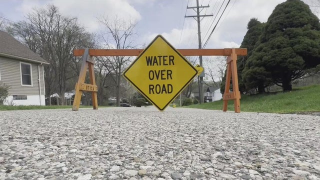 Residents wait for floodwaters to recede in Utica, Michigan 