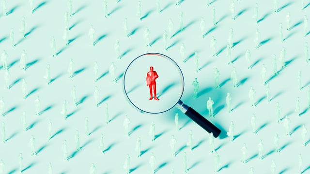Businessman Under Magnifying Glass Concept of Recruitment and Selection 