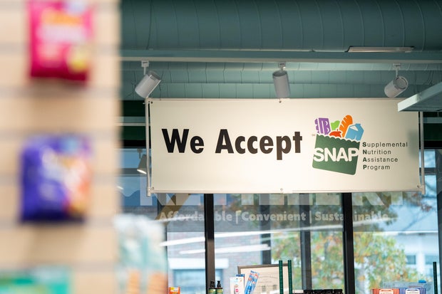 A sign for SNAP (food stamp) benefits at a supermarket