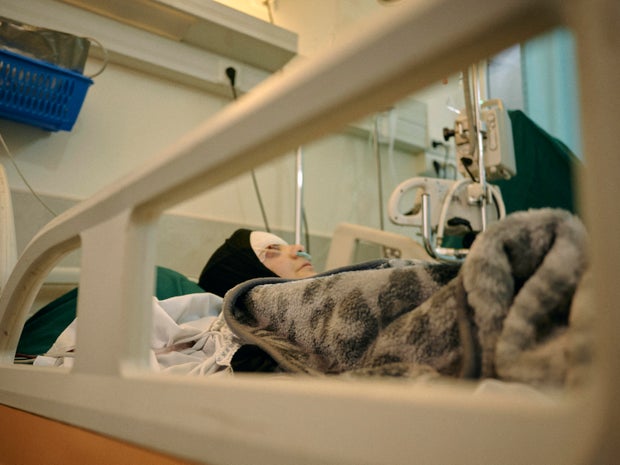 Journalist Zeinab Faraj, 21, is seen in her hospital bed in Tibnine, Lebanon, April 23, 2026. 
