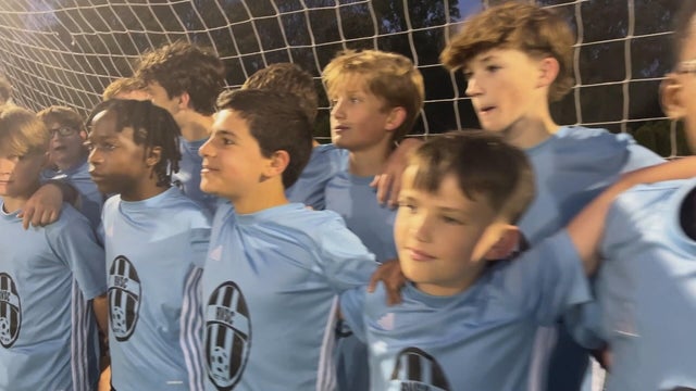 Players with Rancocas Soccer Club smile for a photo 