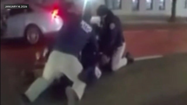 NYPD officers pinning man to ground 