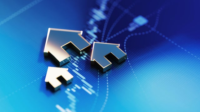 Investment Concept - House Symbols On Blue Financial Graph Background 