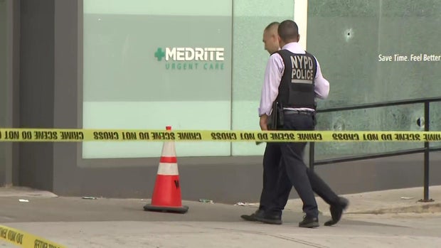 Bullet holes in window of urgent care 