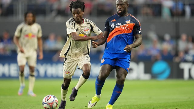 K&eacute;vin Denkey #9 of FC Cincinnati passes the ball against Mohammed Sofo #37 of Red Bull New York during the first half of an MLS soccer match at TQL Stadium on April 25, 2026 in Cincinnati, Ohio. 