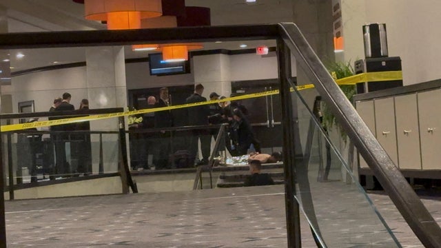 Law enforcement personnel detain suspect in the shooting incident at the White House Correspondents' Association dinner, in Washington 